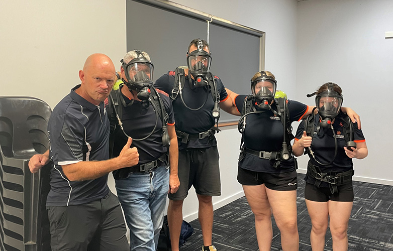 LLC staff testing out breathing apparatus