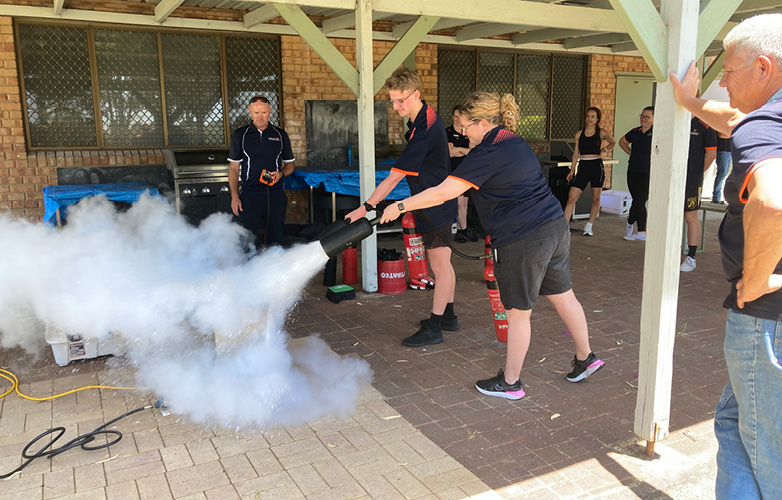 LLC staff testing out fire extinguishers